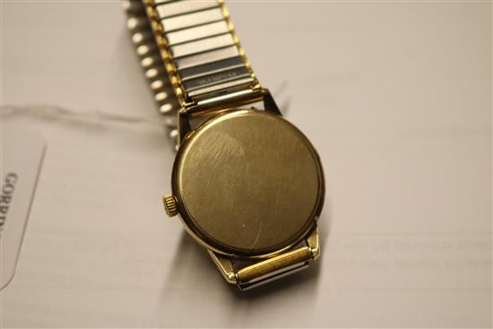 A gentlemans 9ct gold Longines manual wind wrist watch.